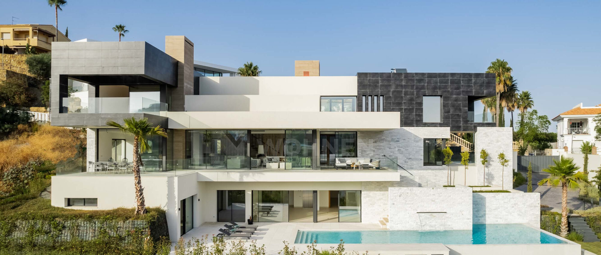 New modern villa with views of the golf course and the sea